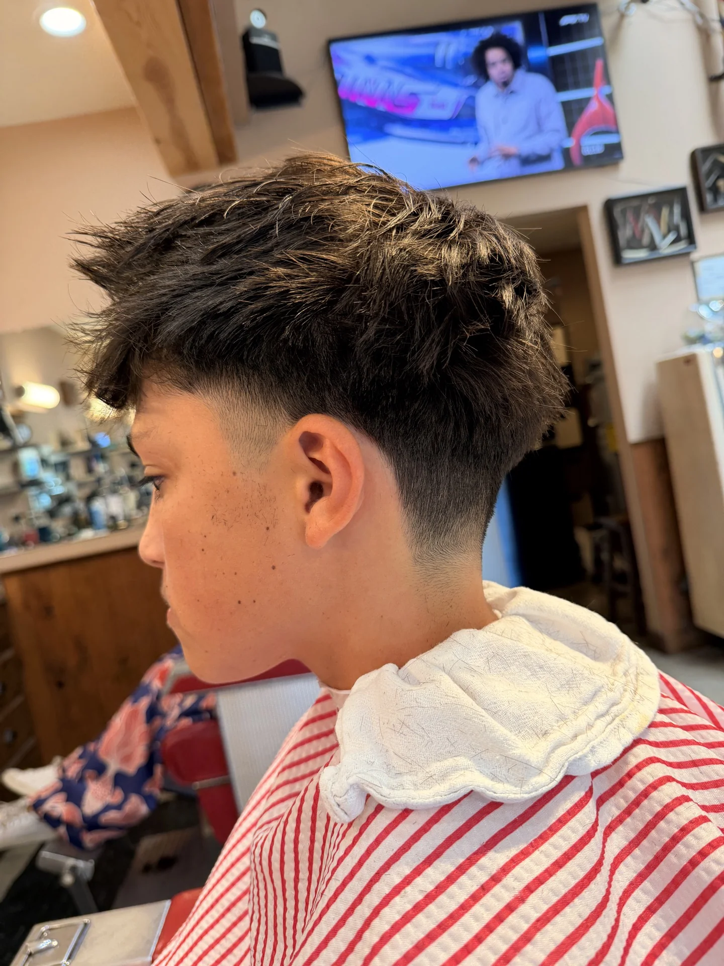 Barber at work at Miller's Barber Shop in Bend, Oregon